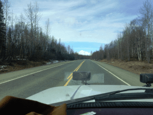 A view of the road from inside a car.